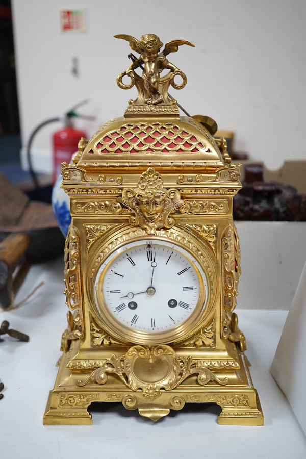 A 19th century French ormolu clock, striking on a bell, 34cm high. Condition - good